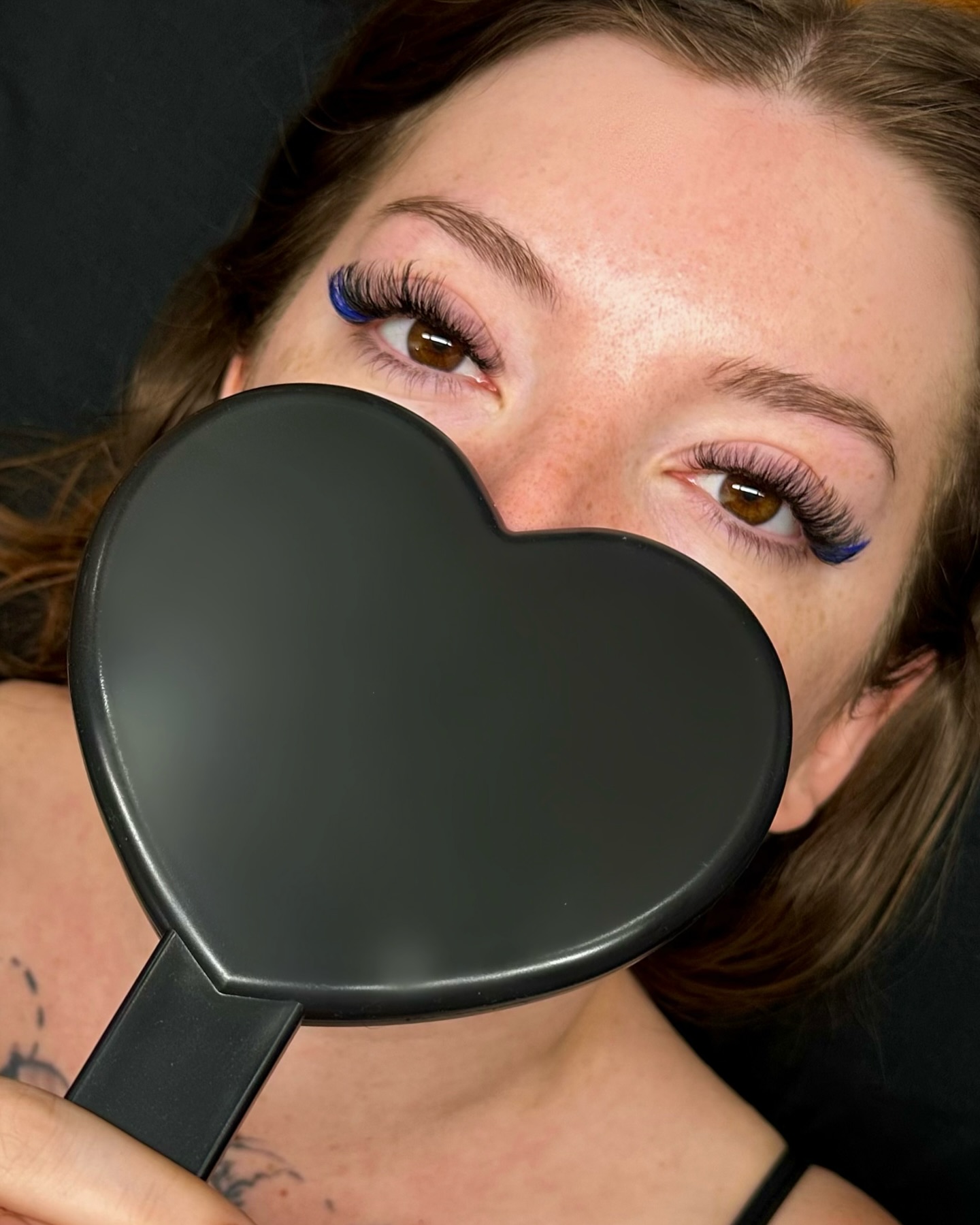 Blue accent lash artistry — heart mirror